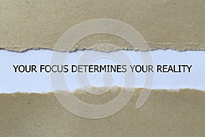 your focus determines your reality on white paper photo