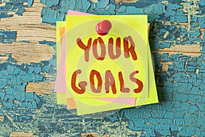 YOUR GOALS text written on sticky note