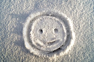 Your happy face in the snow.
