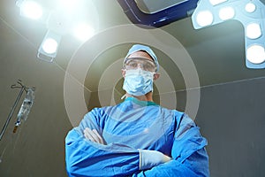 Your life is in good hands. Low angle shot of a surgeon in an operating room.