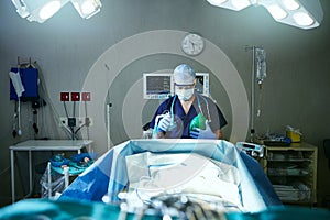 Your life is in safe hands. a surgeon in an operating room.