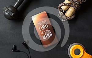 Your only limit is your mind. Inspirational motivational quotes fitness healthy goals with mockup mobile phone on grunge black photo