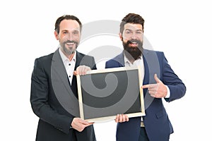 Your logotype here. Happy men pointing fingers isolated on white. Marketing experts pointing at blackboard. Pointing