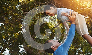 Your my favourite little man. a father and his young son spending quality time together outside.