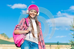 Your own learning center. Happy child listen to music sunny outdoors. Audio learning. Listening comprehension skills