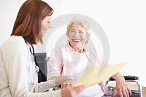 Your recovery is astounding - Senior Care. Elderly patient is delighted by the good news her nurse has just given her.