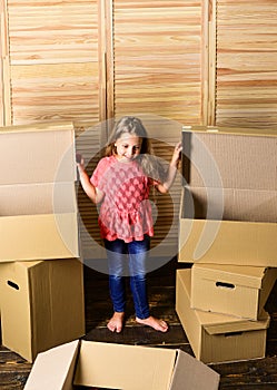 At your service. happy child cardboard box. repair of room. new apartment. happy little girl with bear toy. Cardboard