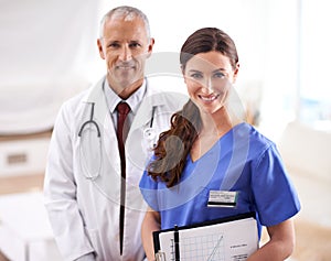 Your smiling surgical team. Portrait of two friendly medical professionals.