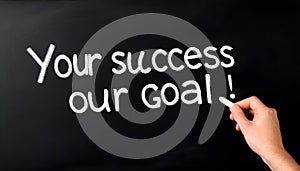 Your success is our goal - business concept chalkboard or blackboard with female hand and chalk