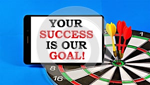 Your success is our goal. Text message on the background of a dartboard. Successful strategy in school and business, career