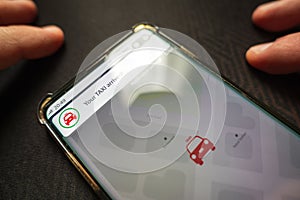 Your taxi dispatched notification smartphone screen app photo