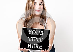 Your text here written on virtual screen. technology, internet and networking concept. beautiful woman with bare