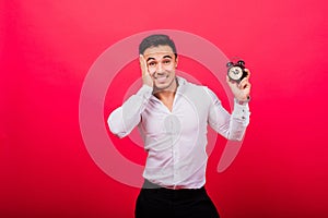 It is your time. Portrait of young man in showing time on clock watch, ok, thumb up, approve