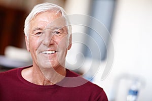 Youre only as old as you feel. Portrait of a happy senior man at home.