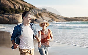 When youre at the beach you forget about everything else. a middle aged couple spending the day at the beach.