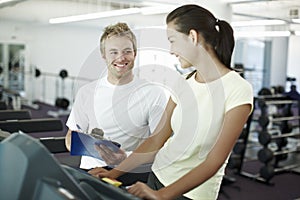 Youre doing great. an attractive young woman working out with her personal trainer.