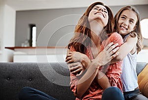 Youre my favourite person in the whole world. an attractive young woman and her daughter hugging while spending time