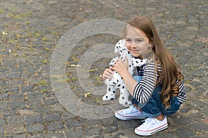Youre my friend. Small girl play with toy dog outdoors. Little child enjoy friendship. Childhood friendship. Developing