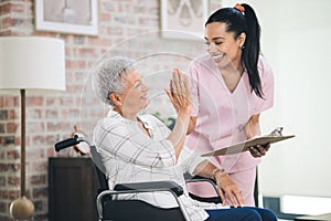 Youre never too old to better yourself. a nurse and an older woman sharing a highfive in a moment of celebrated progress