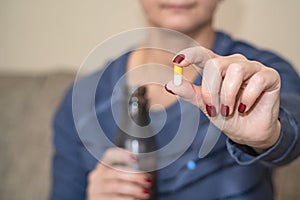 For when youre not feeling quite right. Cropped shot of a woman taking her medication at home