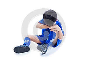 Youth asian soccer player crying for a painful knee injury. Full