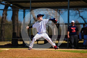 Youth baseball pitcher in wind up photo