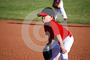 Youth baseball player hands on knees