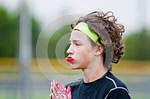 Youth football boy with long hair