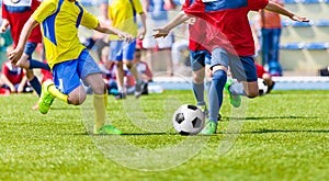 Youth football soccer match. Kids playing soccer game on sport field