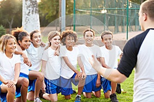 Youth Football Team Training With Coach photo