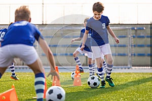 Youth Footballer Running With Ball on Training Time