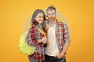 Youth lead way in fashion ideas. Hipster couple students. Fashionable students couple yellow background. Modern couple photo