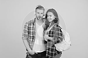 Youth lead way in fashion ideas. Hipster couple students. Fashionable students couple yellow background. Modern couple photo