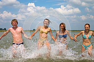 Youth people running in water