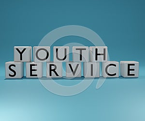 Youth service letter on the dice on the blue background