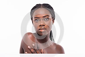 Youth and Skin Care Concept. Beauty African Woman face Portrait. Beautiful model Girl with Perfect Fresh Clean Skin isolated on