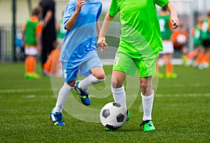 Youth Soccer Players. Boys Kicking Football Ball on the Field