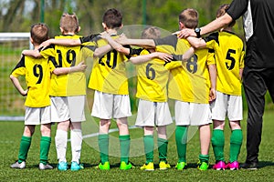 Youth sports team. Young players standing together with coach