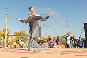 Youth street dances. A young girl performs dance moves