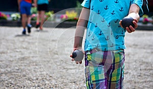 Youth training with tirating or placing boules.