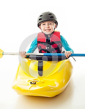 Youth whitewater kayaker sitting in his boat