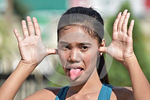 Youthful Diverse Adult Female Making Funny Faces