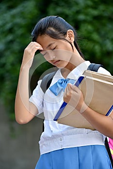 A Youthful Female Student And Sadness