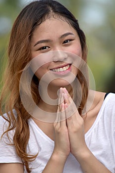 Youthful Filipina Adult Female In Prayer