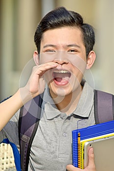 Youthful Filipino Boy Student Shouting With Notebooks