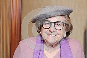 Youthful senior woman smiling close up