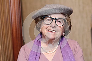 Youthful senior woman smiling close up