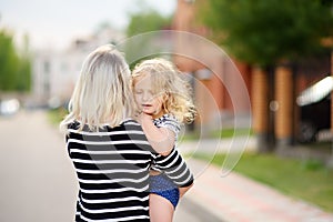 Youthful tender mom with her cute toddler girl