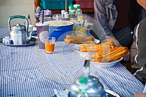 Youtiao Chinese fried churro, Chinese cruller, Chinese oil stick, Chinese doughnut, fried breadstick, long golden brown deep