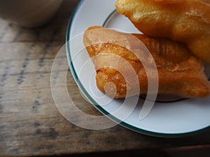 Youtiao likes to eat as breakfast with coffee drinks ottles for cleaning hands during the